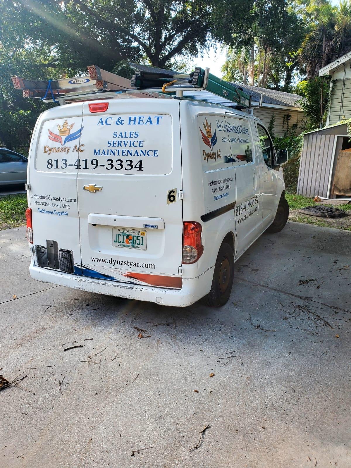 Dynasty AC service van parked in a Tampa Bay driveway