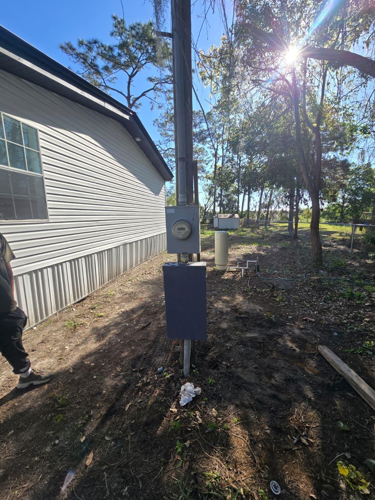 Rural property electrical meter and new panel disconnect mounted on exterior post