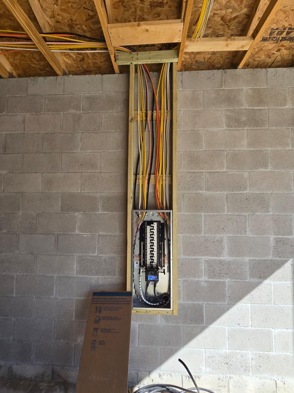 Electrical panel installed in a stud bay during new construction